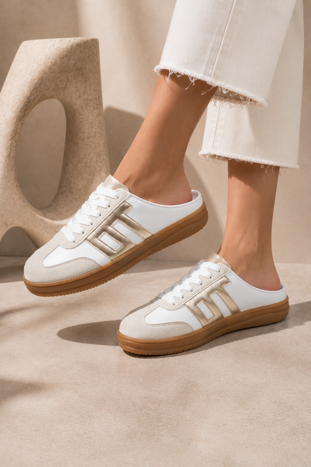 White and gold sneaker mules with gum sole