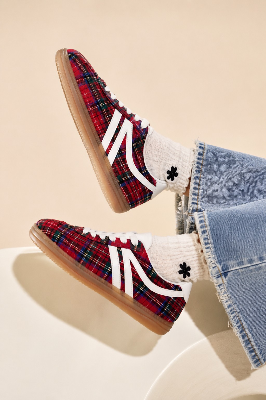 Red tartan plaid sneakers with white stripes and gum sole