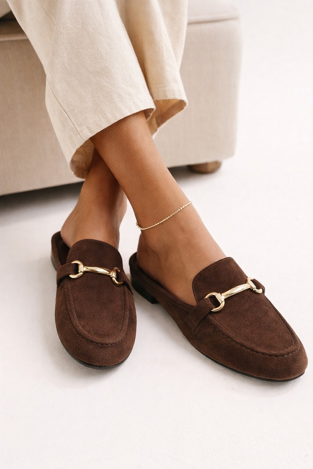Chocolate suede loafer mules with gold bit hardware